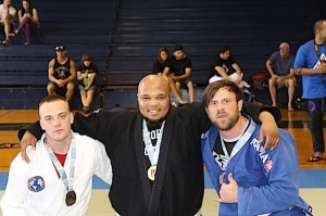 Antonio Nicholson (center) following his win in the Absolute Gi competition.