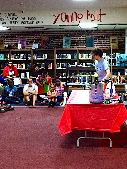 Lindsay Odell of the McWane Center in Birmingham spoke to the audience at the Demopolis Public Library Wednesday about chemical reactions as part of DPL's Fizz, Boom, Read summer reading program.
