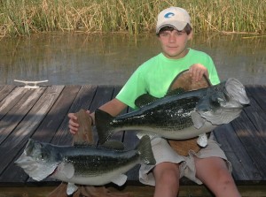 The monstrous size of the largemouth bass caught by 15-year-old Branson Linder of Jackson, Ala., this year is evident when compared to the 10-pounder he caught several years ago. Although Linder held the big bass by one hand on the shore, it took two hands to pull the giant into the boat.
