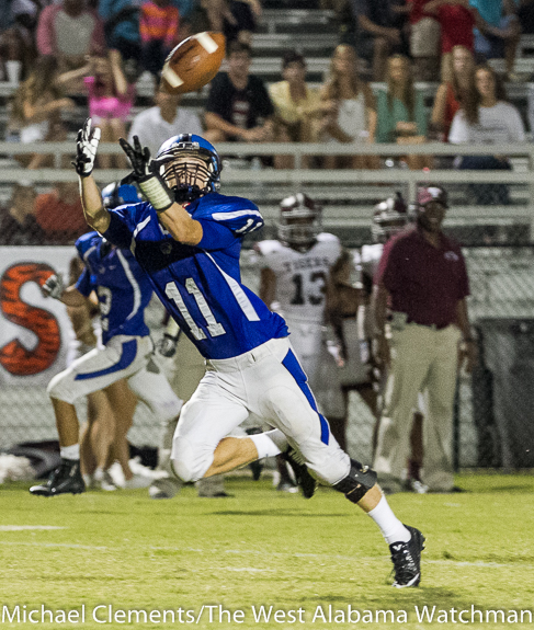 Demopolis senior Seth Aiken looks in a pass from Logan McVay last Friday night against Thomasville. The Tigers are set to travel to Calera this Friday night.