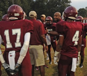 A.L. Johnson head coach Johnny Ford rallies his defense during a timeout.
