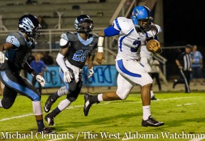 Rashad Lynch breaks free from would be Calera tacklers on his way for a Tiger touchdown.