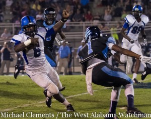 Jayjerrin Craig makes a cut to elude a Calera defender in the Tigers' win over the Eagles.