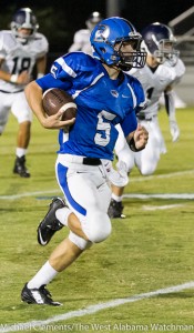Logan McVay breaks into the open field on a touchdown run against Jemison High School.