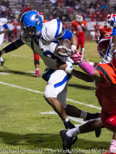 Rashad Lynch pulls away from a would-be tackler on his way to a touchdown against Central Tuscaloosa.