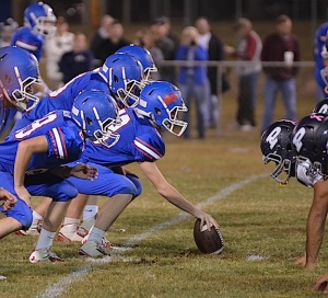 Sumter Academy lines up over the ball on offense last Friday night against Patrician.