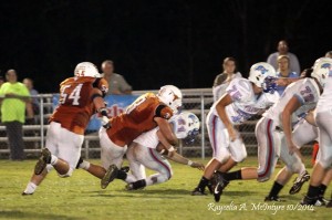 Cason Cook #3 makes the tackle as #54 Tait Sanford comes in for backup if needed.