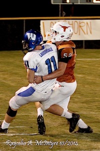 Hayden Hall brings down Wilcox quarterback Drake Lauderdale for one of his 15 tackles on the night.