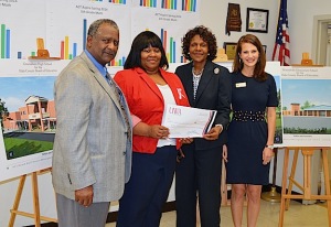 Tameka Ratcliff is presented with a $1,000 award from UWA for the Hale County Technology Center. Ratcliff won the award as a participant in UWA's Education Outreach Summit in October. Pictured left to right are Career Tech Director James Essex; Guidance Counselor Tameka Ratcliff; Hale County Schools Superintendent Osie Pickens; and UWA Online representative Dana Malone.