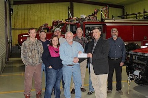 Several Jefferson VFD members accept a check for $5k from the GP Bucket Brigade. Pictured left to right are Tom Whitaker, Tim Day, Betsy Compton, O'Neal Parker, George Norris, Joe Coats, Bobby Lynch, GP Mill Manager Ronnie Hall, and Lewis Compton.