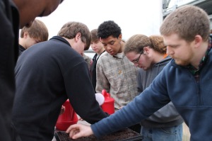 Nick Bussey, right, directs the students on planting the seeds. From left are Clay Collins, Micah Ward and Tommy Waldrop