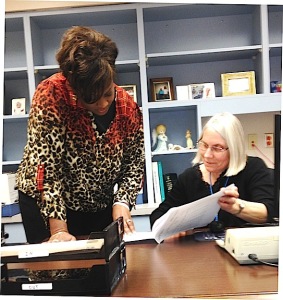 Billing Department Manager San Jones and Clerk Linda Milam look over a patient's claims report.