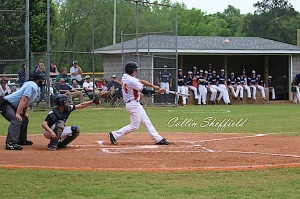 (photo by Collin Sheffield) Hayden Hall strokes a homer in the first inning of game one.