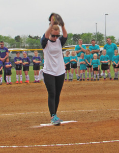 Mary Byars prepares to throw the first pitch in her father's memory.