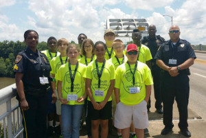 Demopolis Police Youth Leadership Academy (DPYLA) Students got a chance to walk across the historic Edmund Pettus Bridge in Selma chance to walk across the Historical Edmund Pettus Bridge in Selma, Alabama and learned some history while doing so. Pictured with the students are DPD Sgt. Monica Oliver, DPD Officer Marcus Williams and Selma Police Lt. Harris.