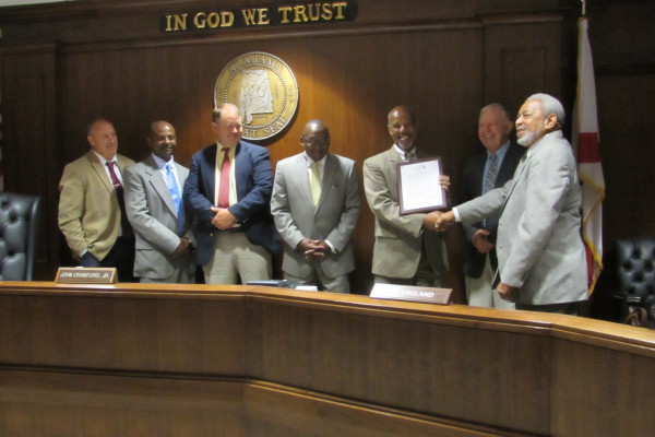 Sen. Bobby Singleton and Rep. A.J. McCampbell were presented a resolution by the Marengo County Commission honoring their work to draft and pass a bill strengthening penalties for drag racing on public roads on Wednesday, July 14, 2015. From left, Michael Chambers, Calvin Martin, John Crawford, Singleton, McCampbell, Dan England, and Freddie Armstead. (PHOTO | Jan McDonald)
