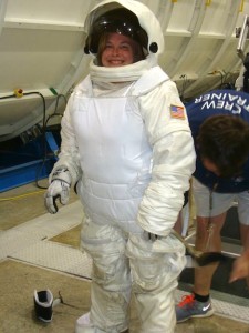 Andrea Clanahan suits up for a simulated trip to the International Space Station.