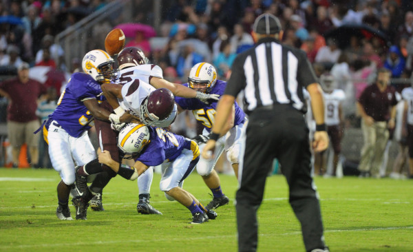Bulldogs defense knocks the ball free in action against the Tigers of Thomasville. (Photo by Johnny Autery)