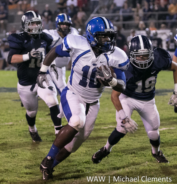 Keishaun Scott outruns several Jemison defenders on his way to the end zone.