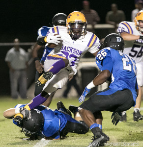 9-25-2015 - Demopolis, Ala. - R.J. Cox hangs on for a shoestring tackle as Marcus Wright closes in.