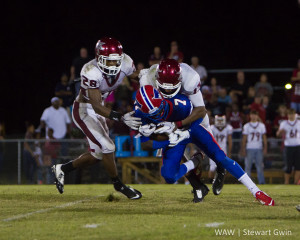 9-18-15 -- Linden, Ala. -- Linden's Dequan Charleston (7) attempts to break the tackle of Maplesville's Nathaniel Watson (13). Linden fell to Maplesville, 20-7. 