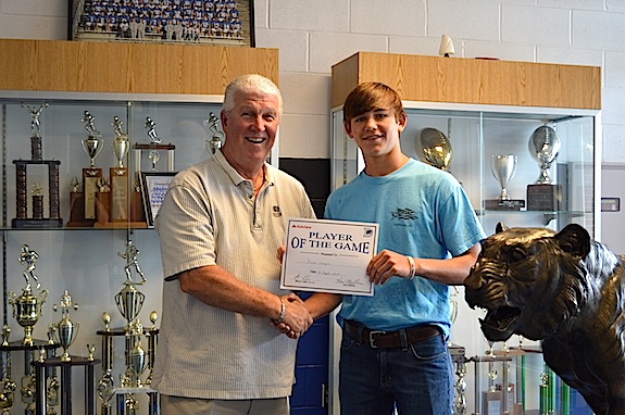 Russ Logan is honored as the Defensive Player of the Week in the Tigers win over Calera.