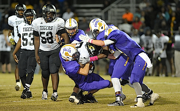 (Photo by Johnny Autery)  A swarming defense lead by Luke Davis (25) held the Tiger's offense to one TD in  Friday night's action in Sweet Water