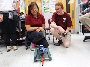  Senior Minh Chau Nguyen (left) and Junior Breck Combs (right) designed, built, and programmed a remote controlled vehicle/robot with a working claw and a mount for a phone/iPod/camera. Using Skype, the engineering students were able to communicate with students in two other classes.