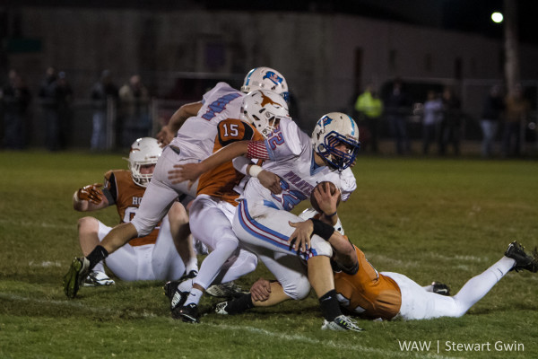 10-13-15 -- Linden, Ala. -- Pickens Academy QB Ryan Harcrow (22) is tackled by Marengo Academy's Caleb Broadhead (15) and Robert Tutt (12) during Friday's game against Pickens Academy in Linden, Ala.. (WAW | Stewart Gwin)