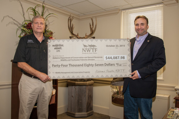 National Wild Turkey Federation Representative Craig Scruggs, left, presents a check to Wildlife and Freshwater Fisheries Division Director Chuck Sykes. (Contributed Photo)