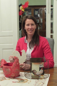 Cynthia Phillips, chairman of the Cock's Crow 5K, shows some of the rooster-themed door prizes to be given away at Rooster Day. (Contributed Photo)
