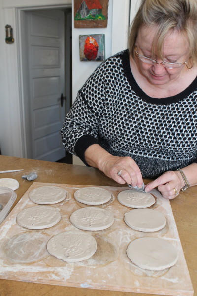 Carolyn Cowling, a local potter, is creating one-of-a-kind medals for the Cock's Crow 5K winners. (Contributed Photo)