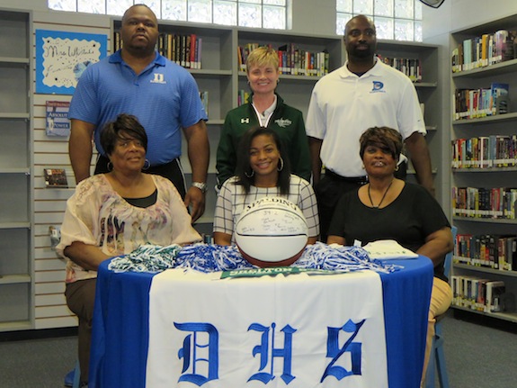 Ivery Moore alongside her grandmother Beatrice Phillips, aunt Betty Jeanette Jones, Demopolis High coaches Ronnie Abrams and Tony Pittman and Shelton State coach Madonna Thompson.