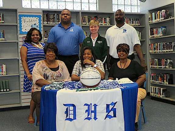 Ivery Moore alongside her grandmother Beatrice Phillips, aunt Betty Jeanette Jones, family friend Reshinda Bryant, Demopolis High coaches Ronnie Abrams and Tony Pittman and Shelton State coach Madonna Thompson.