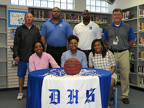 Courtney HIll, DeeDee White and Ivery Moore with Demopolis High athletic director Stacy Luker, DHS girls basketball coaches Ronnie Abrams and Tony Pittman, and DHS principal Chris Tangle. 