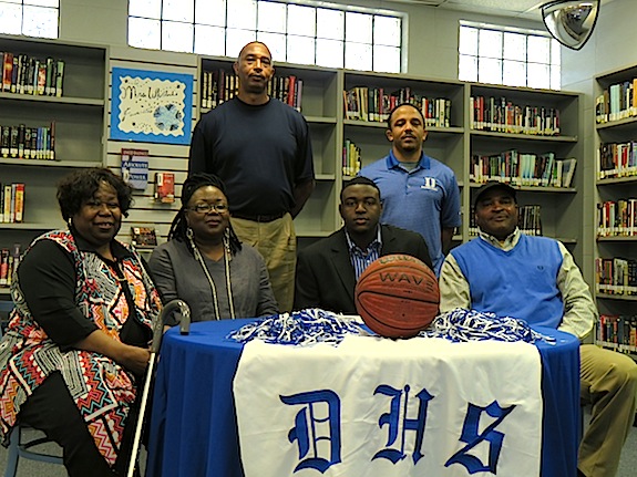 Demopolis High standout Josh Moore signed to play basketball with Southern Union. He is pictured with Southern Union coach Ron Radford, Demopolis High basketball coach Ashley Allen, his grandmother Willia Johnson, and his parents Pracey and Michael Moore. 