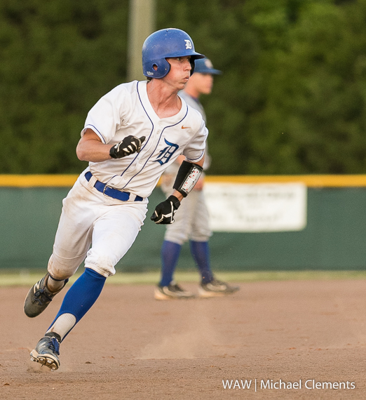 5-6-2016 - Demopolis, Ala. - Jonathan Lewis checks the situation at the plate as he heads into third base in game two against Rehobeth.