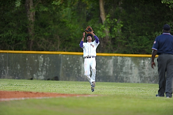 (Photo by Johnny Autery) Will Huckabee secure sa ball in right field.
