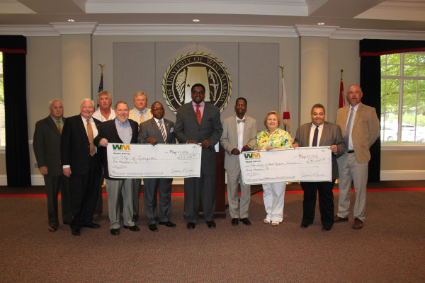 UWA gathered with local and state officials to accept gifts from Waste Management corporation. Pictured left to right are UWA Foundation Chairman Jimmy Collins, UWA Provost Tim Edwards, City of Livingston Administrator Bird Dial, Livingston Mayor Tom Tartt, Waste Management’s Rene Fauxcheux, Senator Bobby Singleton, Sumter County Commissioner Marcus Campbell, Rep. Ralph Howard, Rep. Elaine Beech, Waste Management’s Mike Davis, and Livingston Councilman Pat Ezell.  (Contributed Photo)