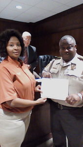 Marengo County Sheriff Ben Bates with Aquanetta Daniels.