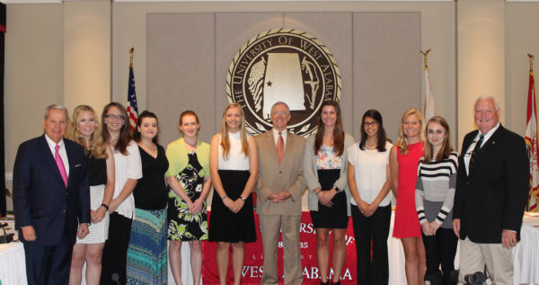 The first cohort of the Tutwiler Scholars Program at the University of West Alabama was introduced at the September Board of Trustees meeting. Pictured from left to right, UWA Board of Trustees President Jerry Smith, Sarah Miles, Destiny Langford, Kiersten Schellhammer, Sophia Thompson, Stephanie Metzler, UWA President Ken Tucker, Jade Montgomery, Emylee Tull, Caitlyn Muncher, Anna Holycross, and UWA Provost Tim Edwards. Not pictured: Jack Shiels. (WAW | Contributed)