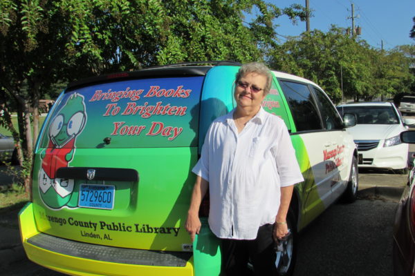 Marengo County Librarian Joyce Morgan with the county's new Bookmobile at the Marengo County Commission meeting in LInden on Tuesday, Sept. 13. (WAW | Jan McDonald)