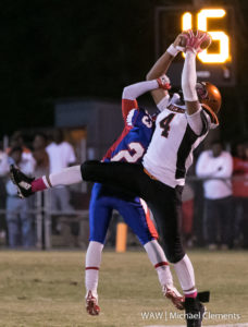 10-14-16 -- Linden, Ala. -- Marengo High's De'Angelos Crispin (4) makes a catch over Linden High's Jonathan Biggs (23) during the Panthers game against the Patriots.
