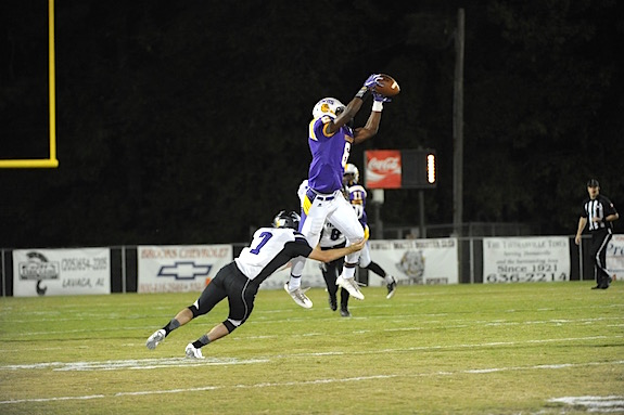 (Photo by Johnny Autery) Sweet Water’s Shamar Lewis (6) leaps high for an interception against Fruitdale.