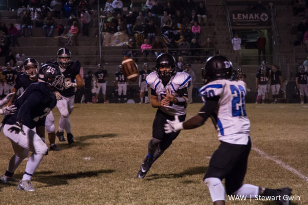 10-21-16 -- Jemison, Ala. -- Demopolis QB Logan McVay (5) tosses the ball to A.J. Besteder (20) in Friday night's game in Jemison. Demopolis beat Jemison, 56-7. (WAW | Stewart Gwin)