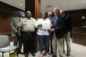Corrections Officer Latesha Jacobs, center, was recognized by the Marengo County Commission for completing the Alabama Jail Training Academy Classes.