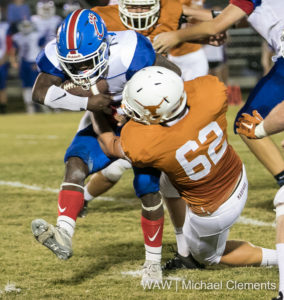 11-3-16 -- Linden, Ala. -- Marengo Academy's Alex Owens (62) stops a Cougar runner in the backfield in the Longhorns game against Crenshaw Academy.