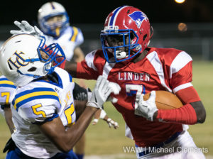 11-4-16 -- Linden, Ala. -- Linden's Dequan Charleston attempts to break the tackle of a Houston County defender during the Patriots' 77-7 win over the Lions.