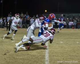 11-25-16 -- Linden, Ala. -- Terence Dunlap (28) and Jakavian McKenzie (5) work to bring down Dequan Charleston (7) in Friday night's game in Linden. Linden fell to Maplesville by a final score of 36-14. (WAW | Stewart Gwin)