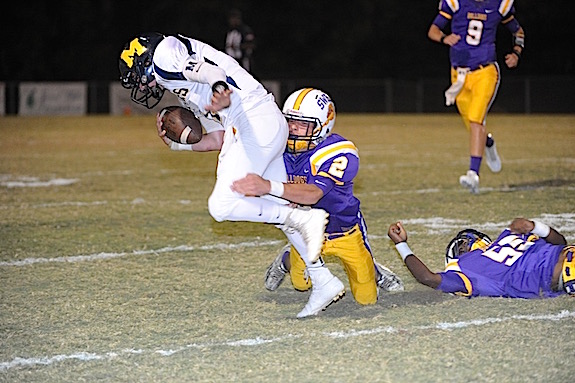 (Photo by Johnny Autery) Bulldog DB Braiden Broussard with a solo tackle on Tiger QB Daniel Gaston.